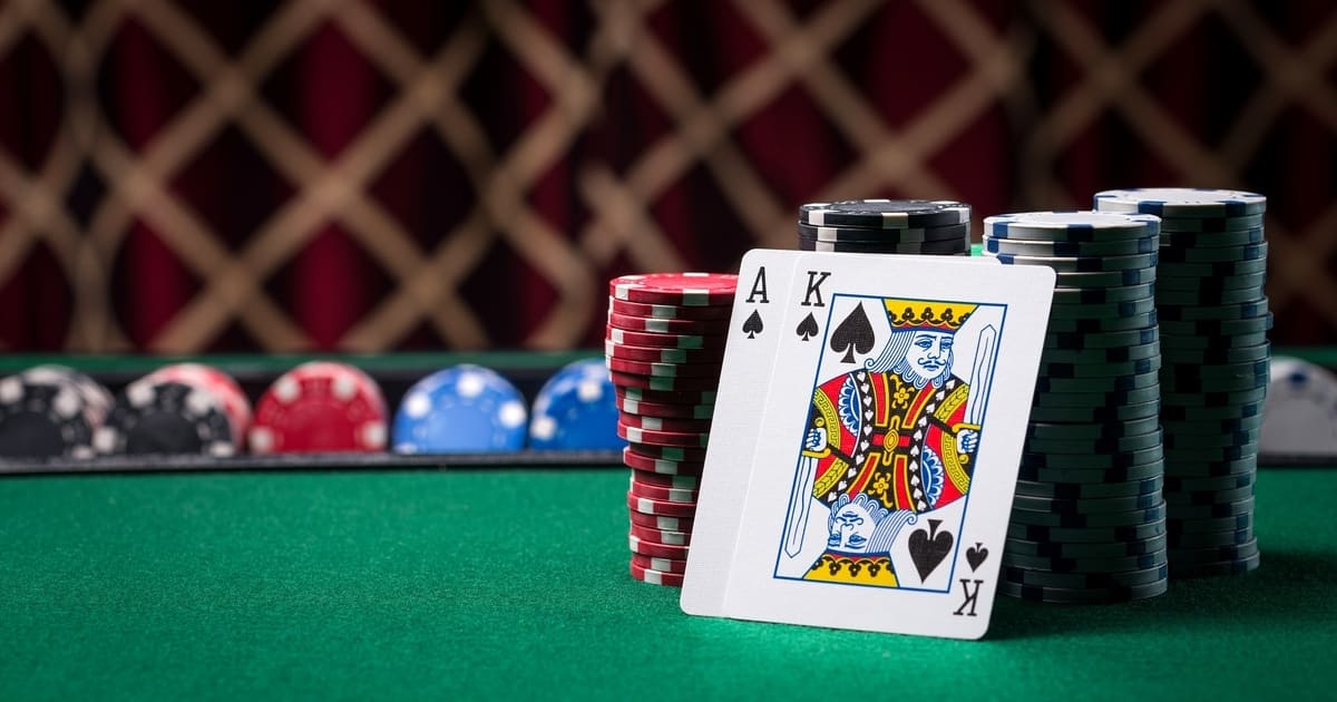 Poker Cards with Chips on a Green Table